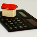 House on top of calculator - How Much Will I Make Selling My House Calculator small