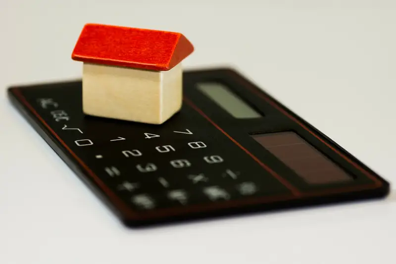 House on top of calculator - How Much Will I Make Selling My House Calculator